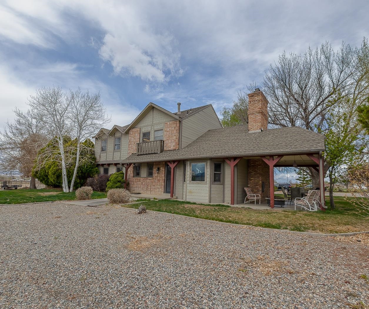 733-35 35 6/10 Road Palisade, CO 81526 - Photo 1 of 42 a front view of a house with a garden