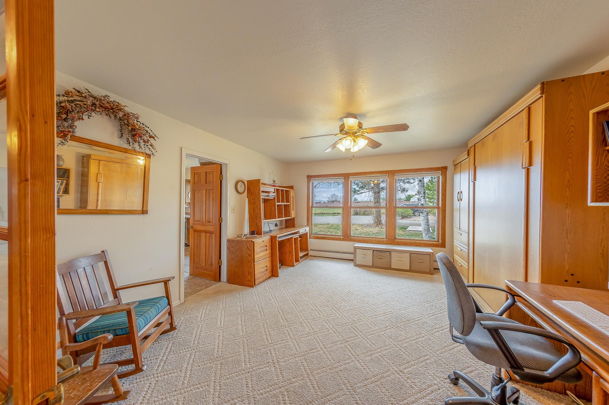 733-35 35 6/10 Road Palisade, CO 81526 - Photo 11 of 42 a view of a workspace with furniture and a window