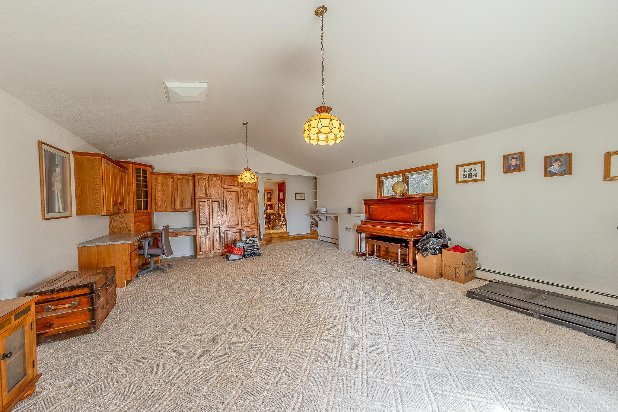 733-35 35 6/10 Road Palisade, CO 81526 - Photo 18 of 42 a view of a room with toys and a chandelier