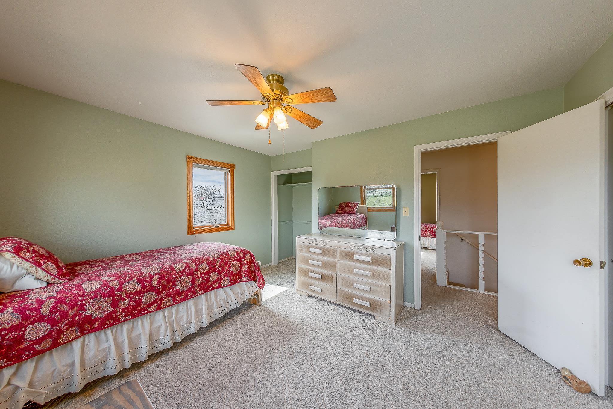733-35 35 6/10 Road Palisade, CO 81526 - Photo 23 of 42 a bedroom with a bed and a chandelier