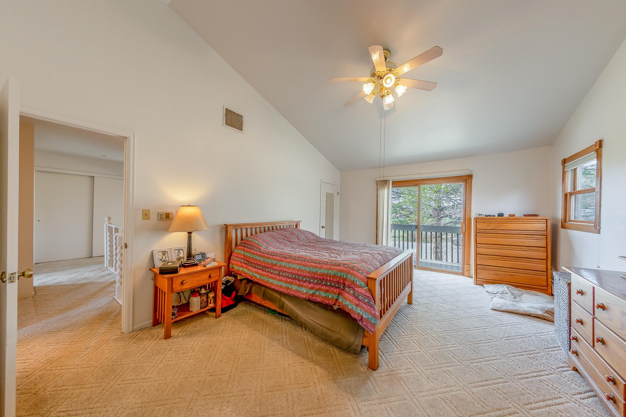 733-35 35 6/10 Road Palisade, CO 81526 - Photo 26 of 42 a bedroom with a bed and a chandelier