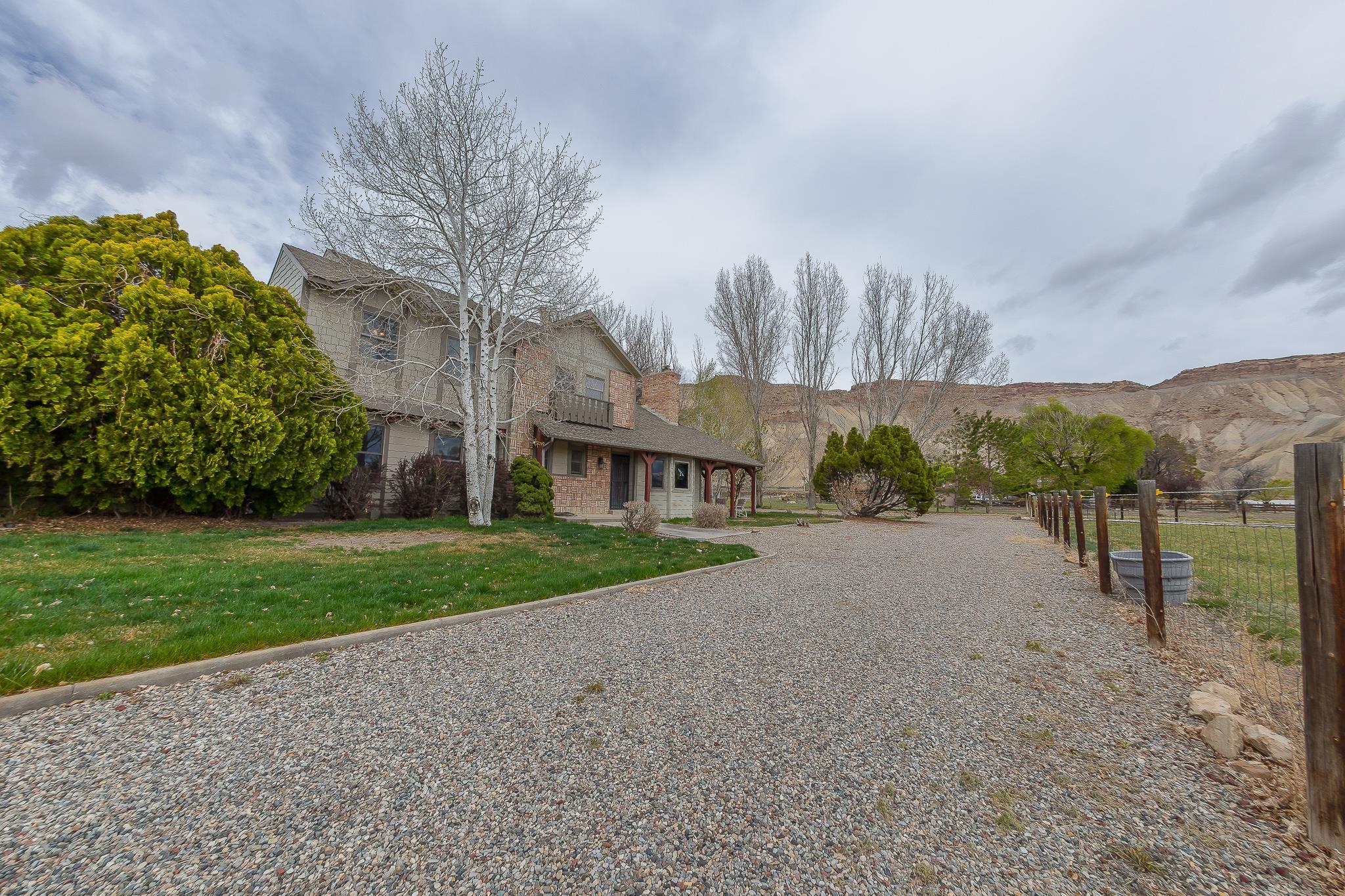733-35 35 6/10 Road Palisade, CO 81526 - Photo 4 of 42 a view of a house with a yard and pathway