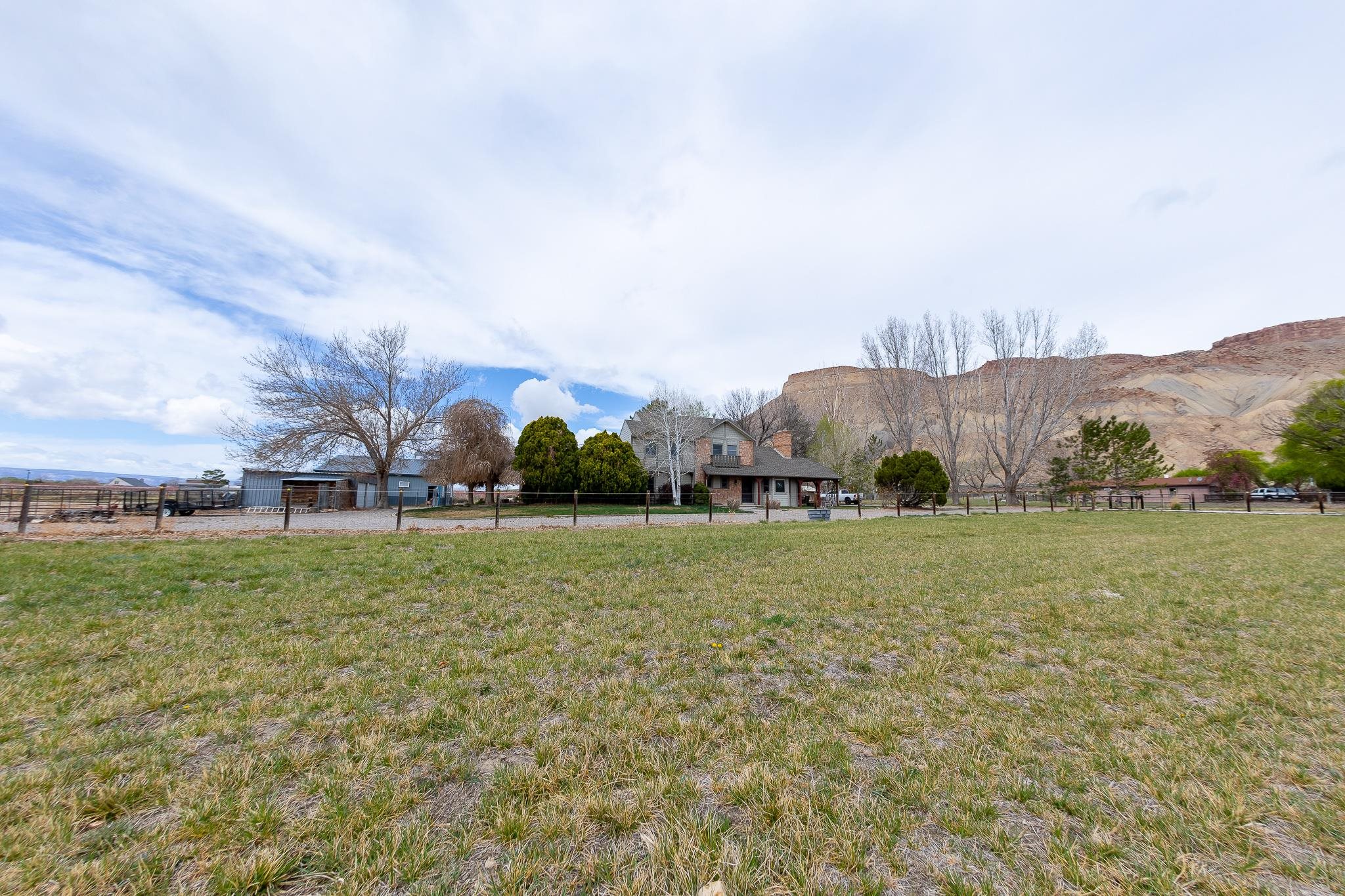 733-35 35 6/10 Road Palisade, CO 81526 - Photo 42 of 42 a view of a green field with mountains in the background