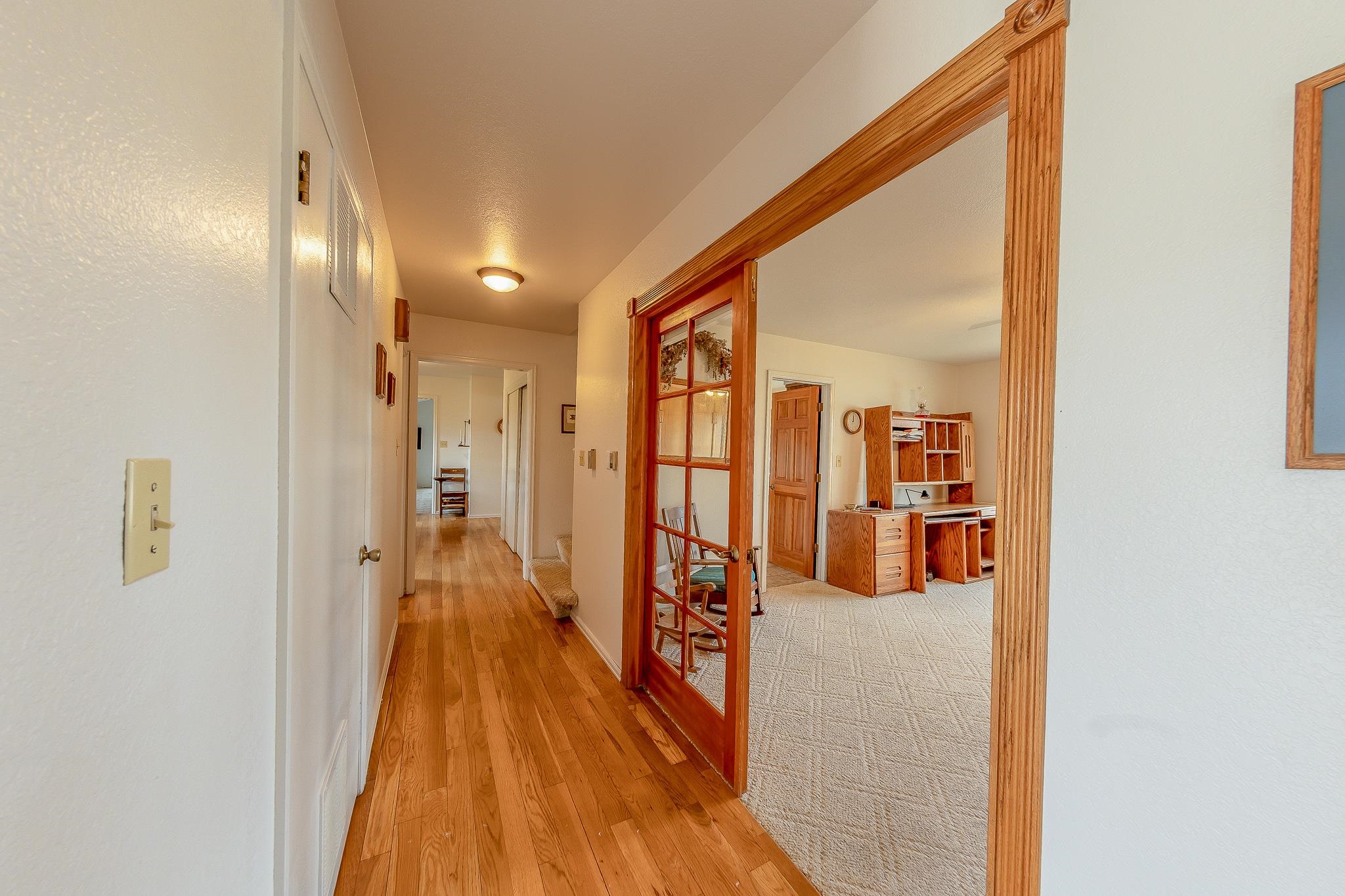 733-35 35 6/10 Road Palisade, CO 81526 - Photo 10 of 42 a view of a hallway with wooden floor