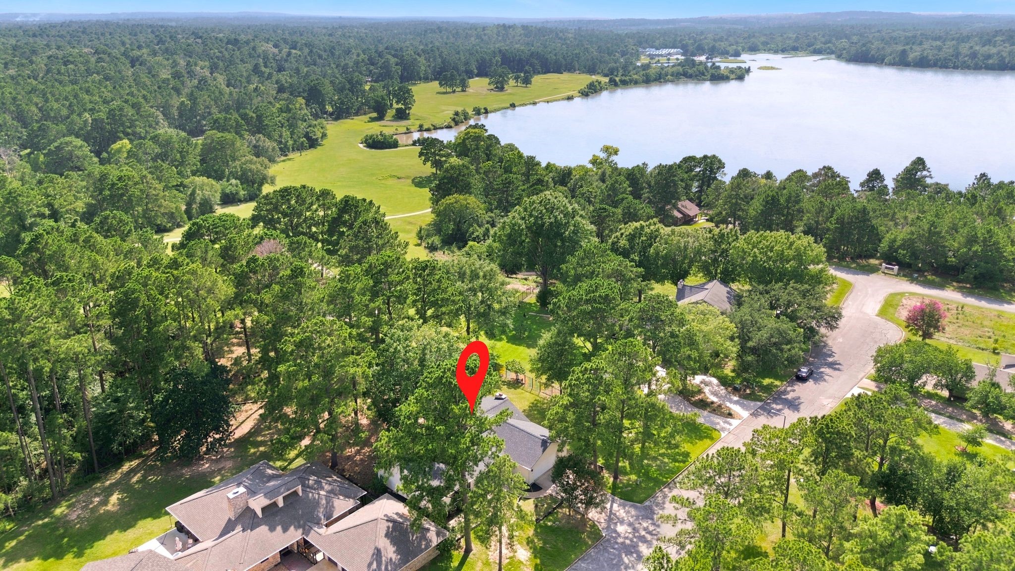22509 Pebble Beach Way Point Blank, TX 77364 - Photo 4 of 30 Sweeping aerial of the lakefront golf community