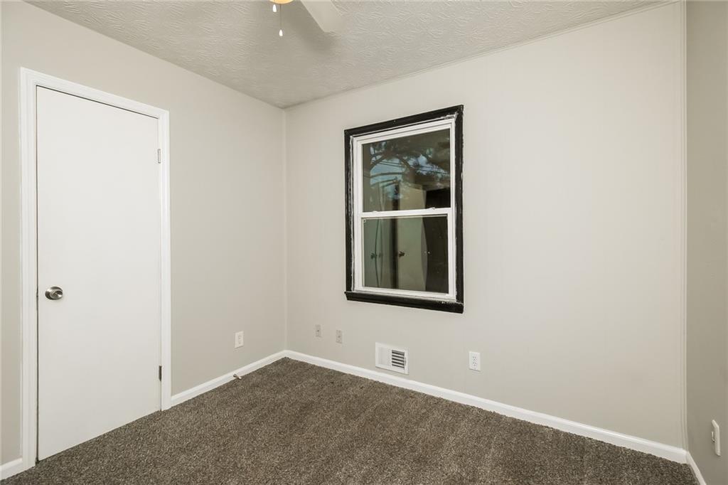 3864 McGill Lane Decatur, GA 30034 - Photo 20 of 25 an empty room with windows and closet