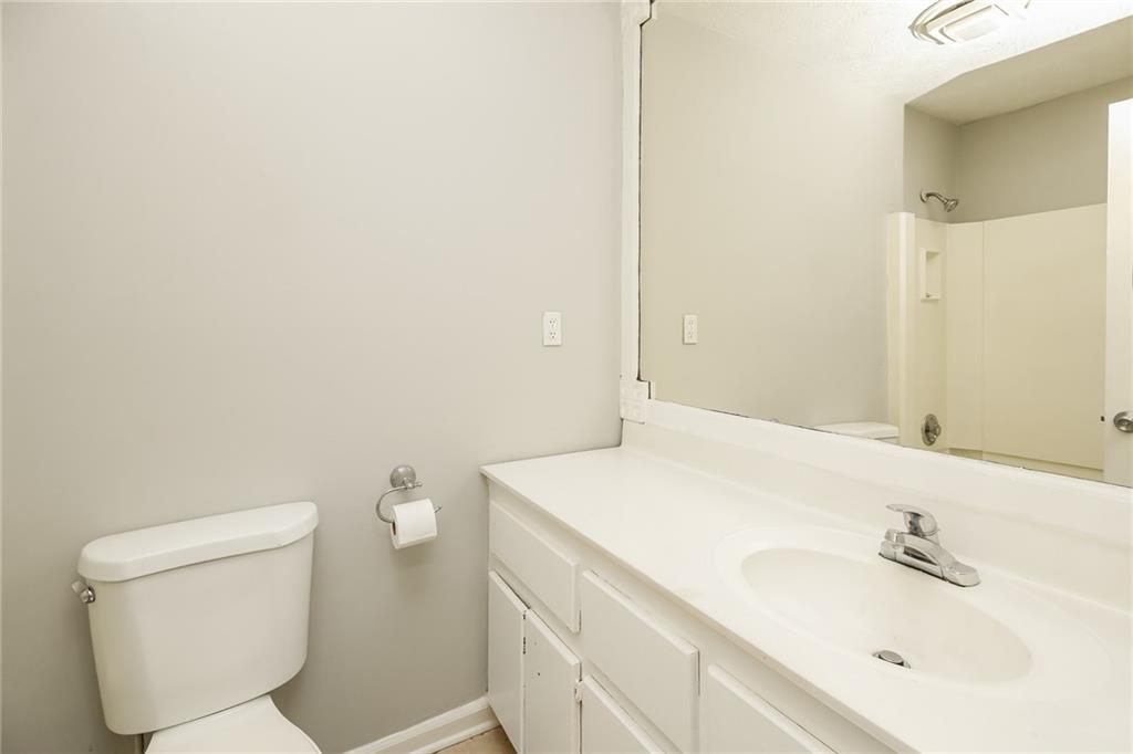 3864 McGill Lane Decatur, GA 30034 - Photo 24 of 25 a bathroom with a sink a toilet and mirror