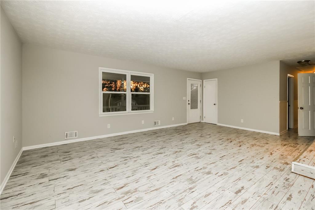 3864 McGill Lane Decatur, GA 30034 - Photo 5 of 25 a view of empty room with wooden floor and fan
