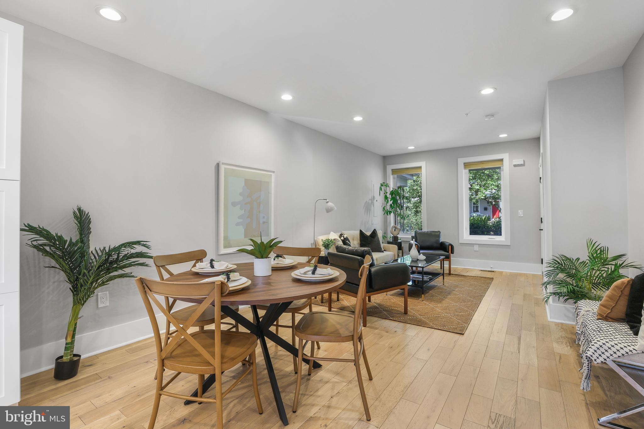 113 U Street Northeast, Unit 1 Washington, DC 20002 - Photo 14 of 63 a living room with furniture potted plant and a window