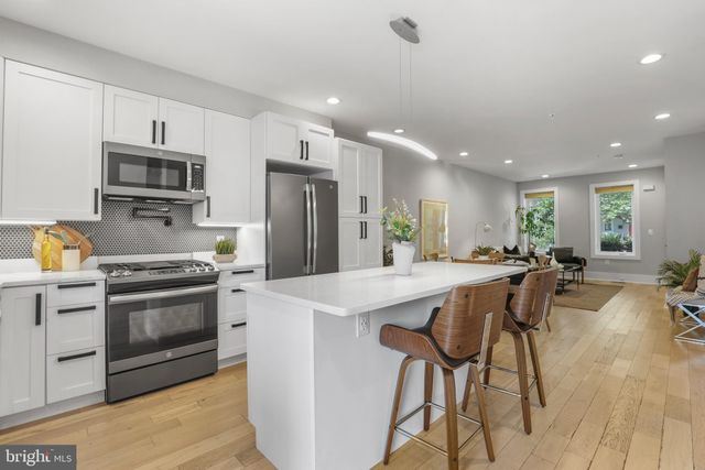 a kitchen with a stove and a microwave