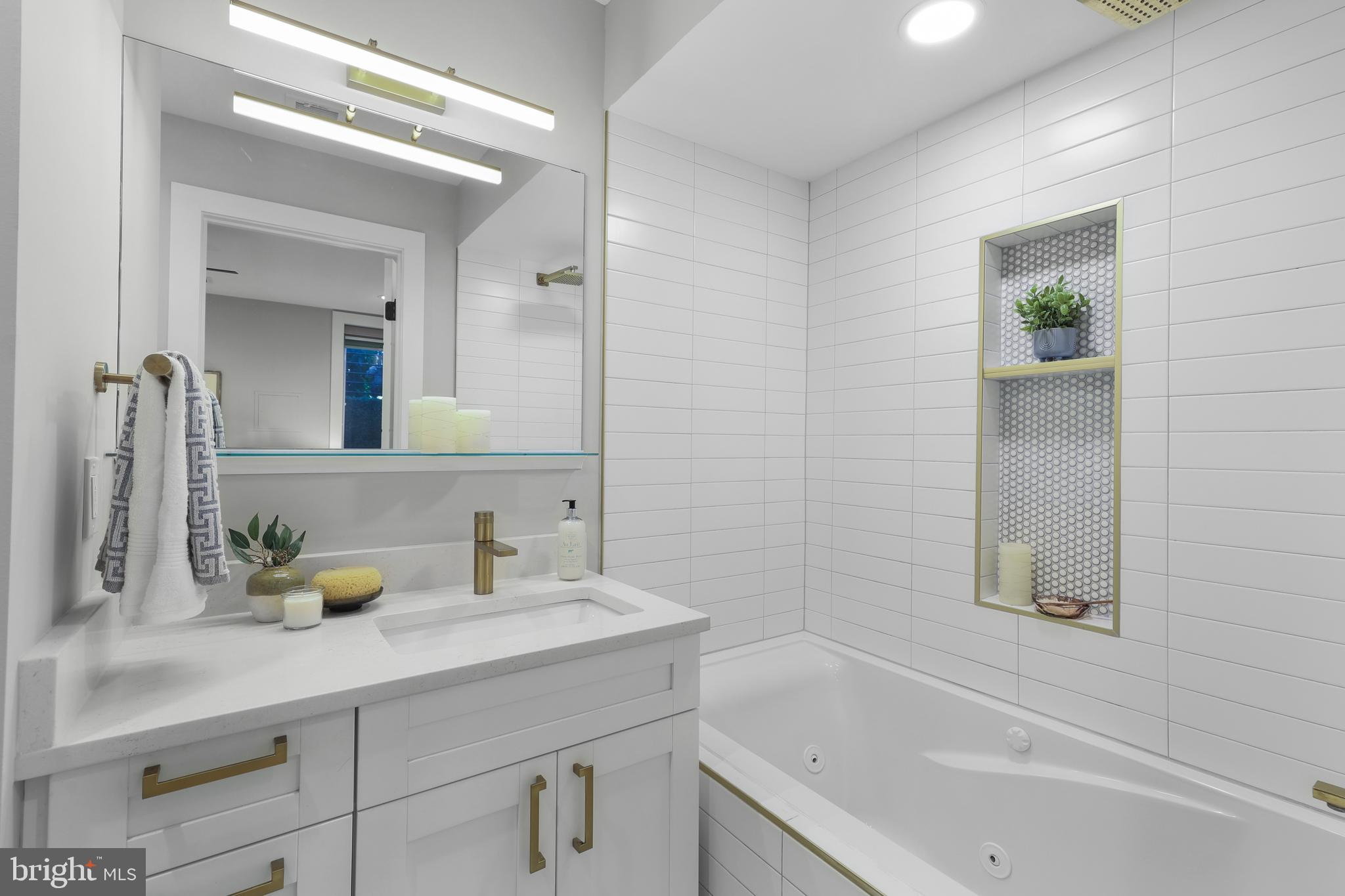 113 U Street Northeast, Unit 1 Washington, DC 20002 - Photo 33 of 63 a bathroom with a granite countertop sink and a mirror