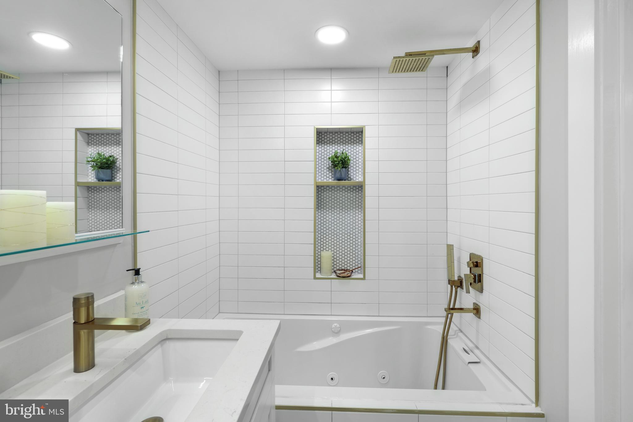 113 U Street Northeast, Unit 1 Washington, DC 20002 - Photo 34 of 63 a bathroom with a tub and a sink