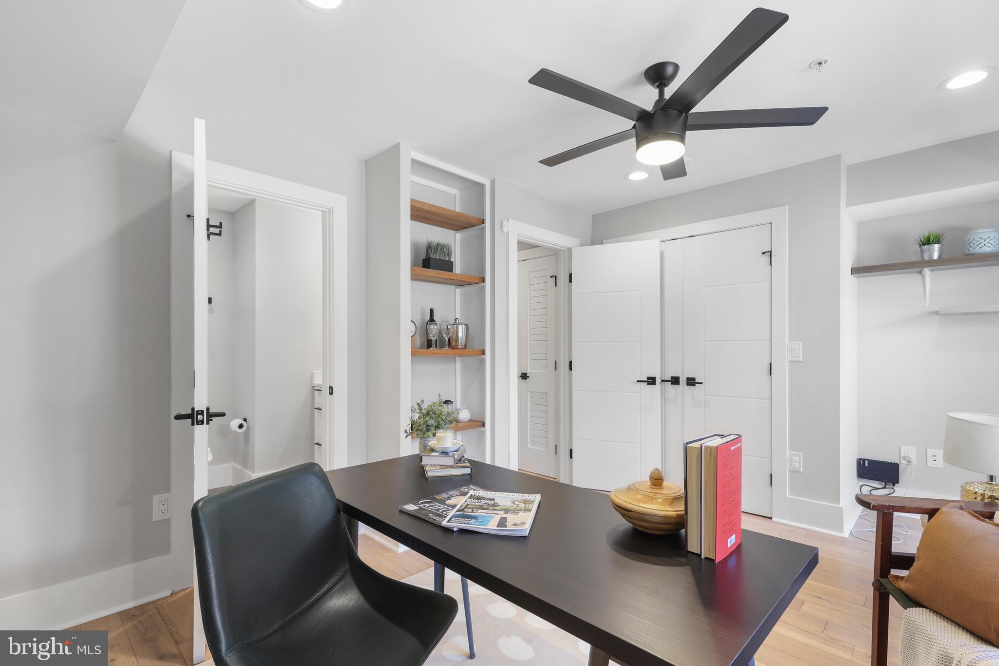 113 U Street Northeast, Unit 1 Washington, DC 20002 - Photo 39 of 63 a view of a workspace with furniture and wooden floor