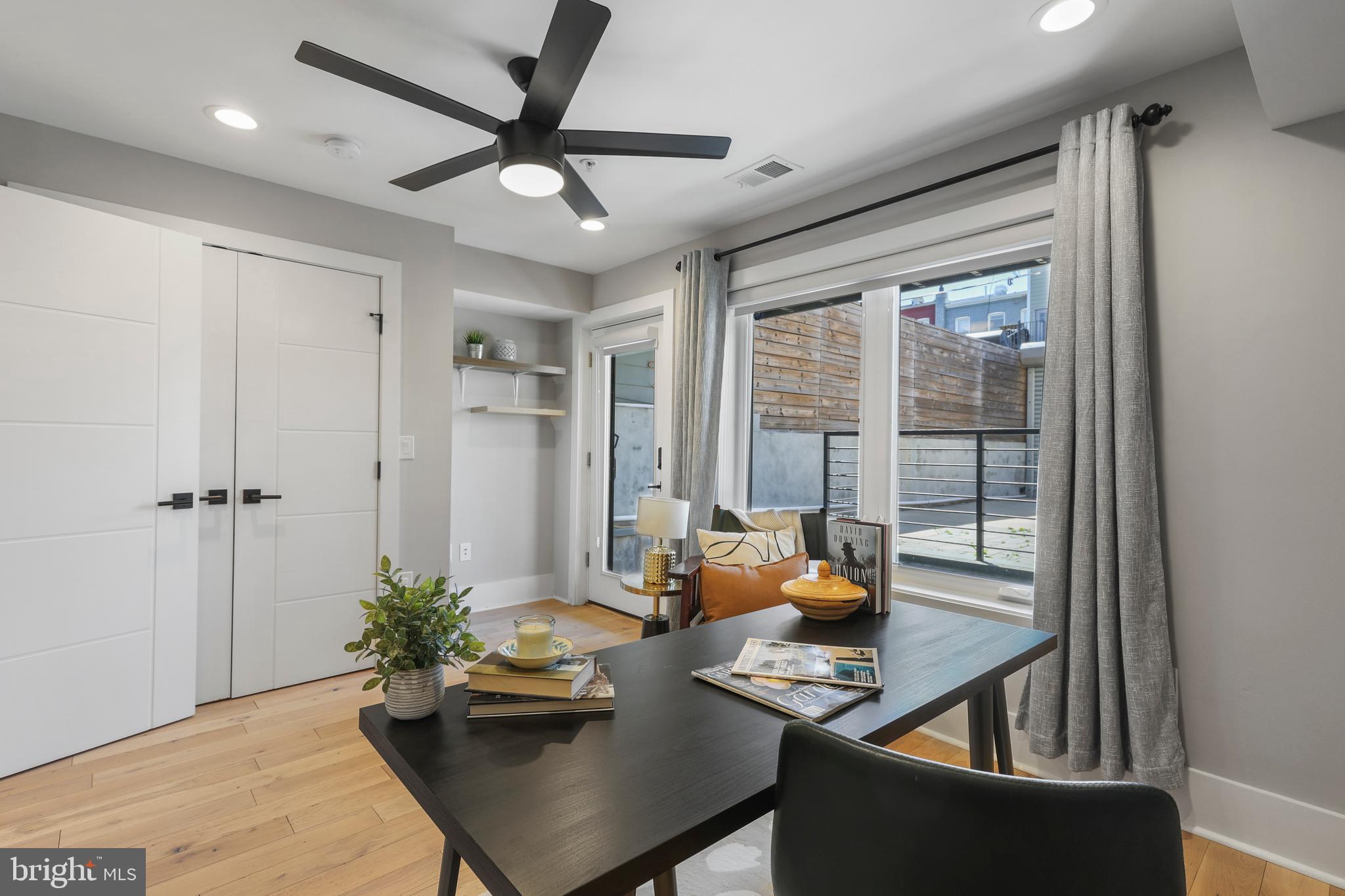 113 U Street Northeast, Unit 1 Washington, DC 20002 - Photo 40 of 63 a living room with furniture and a window