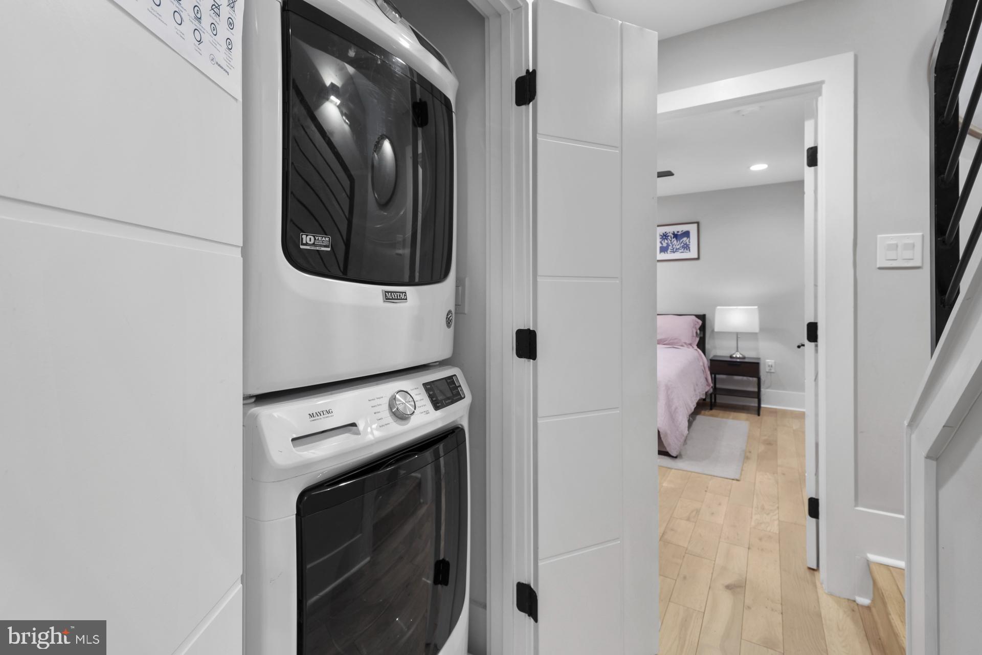 113 U Street Northeast, Unit 1 Washington, DC 20002 - Photo 44 of 63 a view of a hallway with washer and dryer