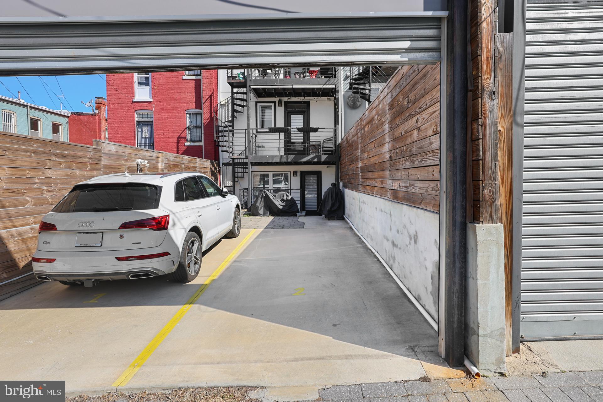 113 U Street Northeast, Unit 1 Washington, DC 20002 - Photo 46 of 63 a view of a car park in front of a building