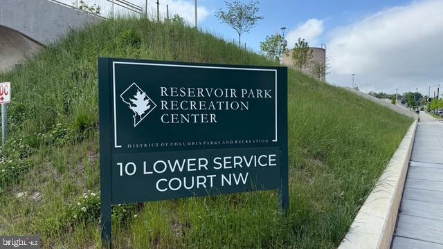 113 U Street Northeast, Unit 1 Washington, DC 20002 - Photo 51 of 63 a sign that is sitting on the side of the green field
