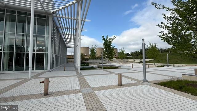 113 U Street Northeast, Unit 1 Washington, DC 20002 - Photo 52 of 63 a view of a patio with a table and chairs and potted plants