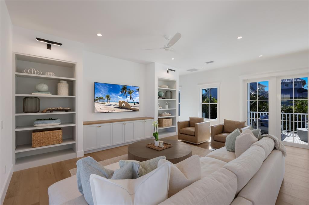 215 Sycamore Avenue Anna Maria, FL 34216 - Photo 12 of 75 a living room with furniture and a kitchen