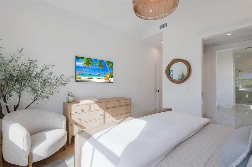 215 Sycamore Avenue Anna Maria, FL 34216 - Photo 30 of 75 a bedroom with a bed and a couch