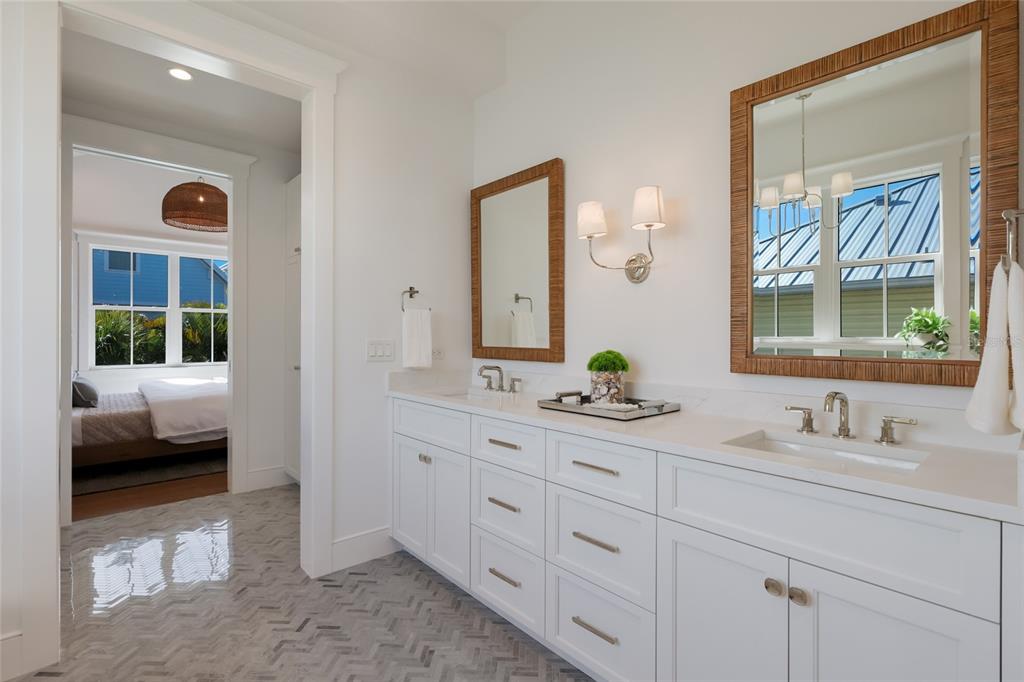 215 Sycamore Avenue Anna Maria, FL 34216 - Photo 32 of 75 a en suite bathroom with 2 sink tub and a mirror