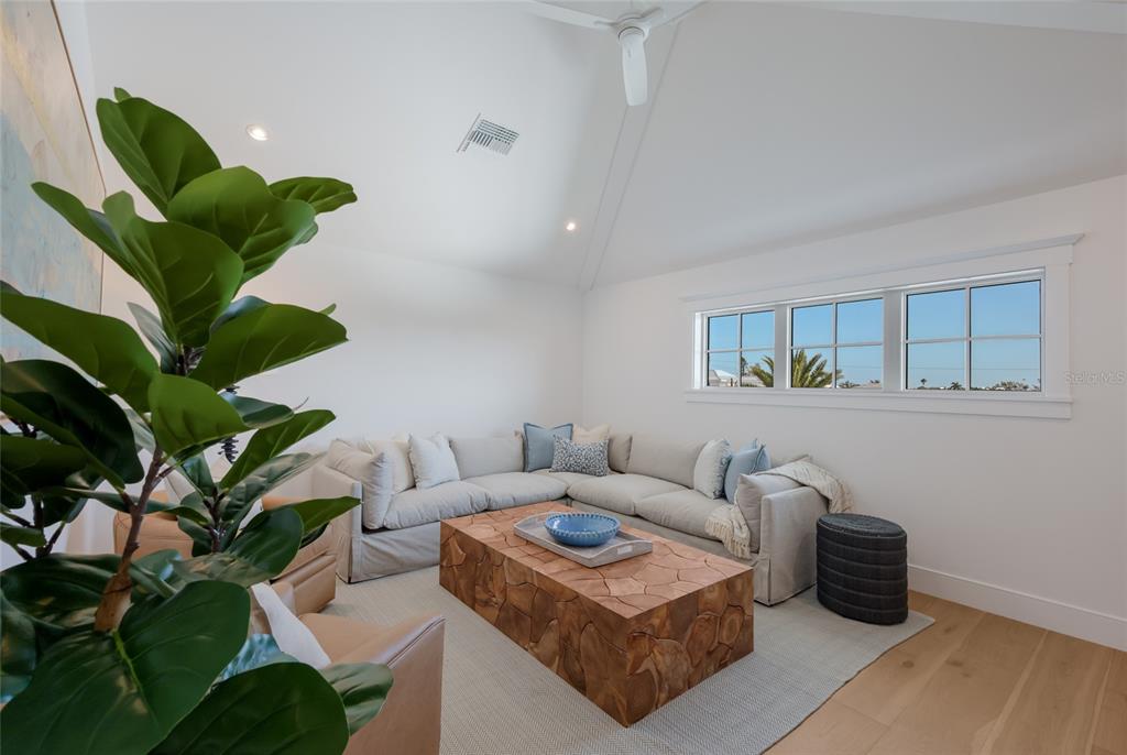 215 Sycamore Avenue Anna Maria, FL 34216 - Photo 40 of 75 a living room with furniture flowerpot and a potted plant