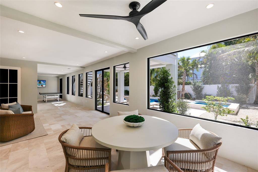 215 Sycamore Avenue Anna Maria, FL 34216 - Photo 55 of 75 a living room with furniture and a large window