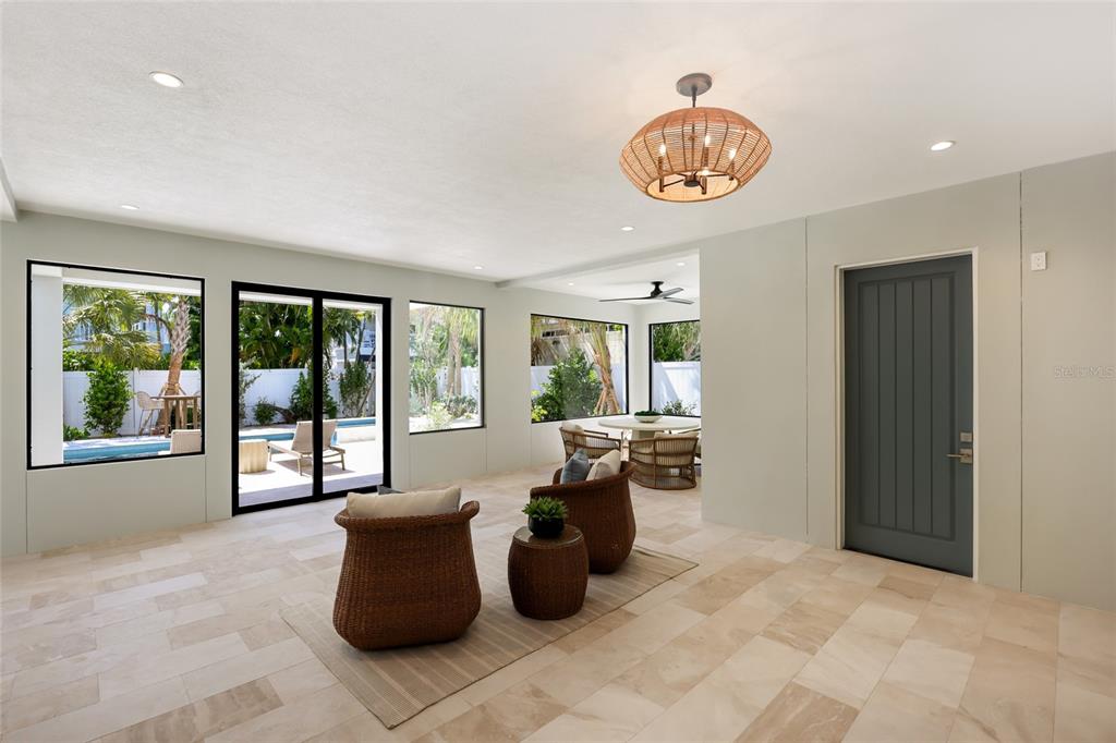 215 Sycamore Avenue Anna Maria, FL 34216 - Photo 6 of 75 a living room with furniture and a large window