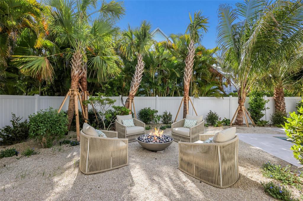 215 Sycamore Avenue Anna Maria, FL 34216 - Photo 61 of 75 a view of a patio with couches and a potted plant