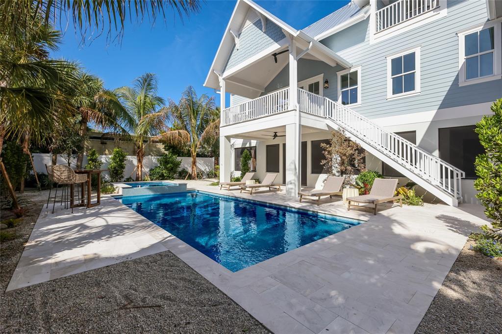 215 Sycamore Avenue Anna Maria, FL 34216 - Photo 64 of 75 a view of a house with pool and sitting area