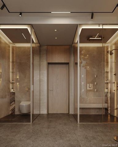 a bathroom with a glass shower door