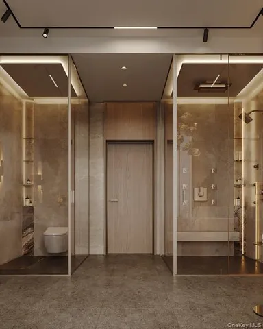 a bathroom with a glass shower door