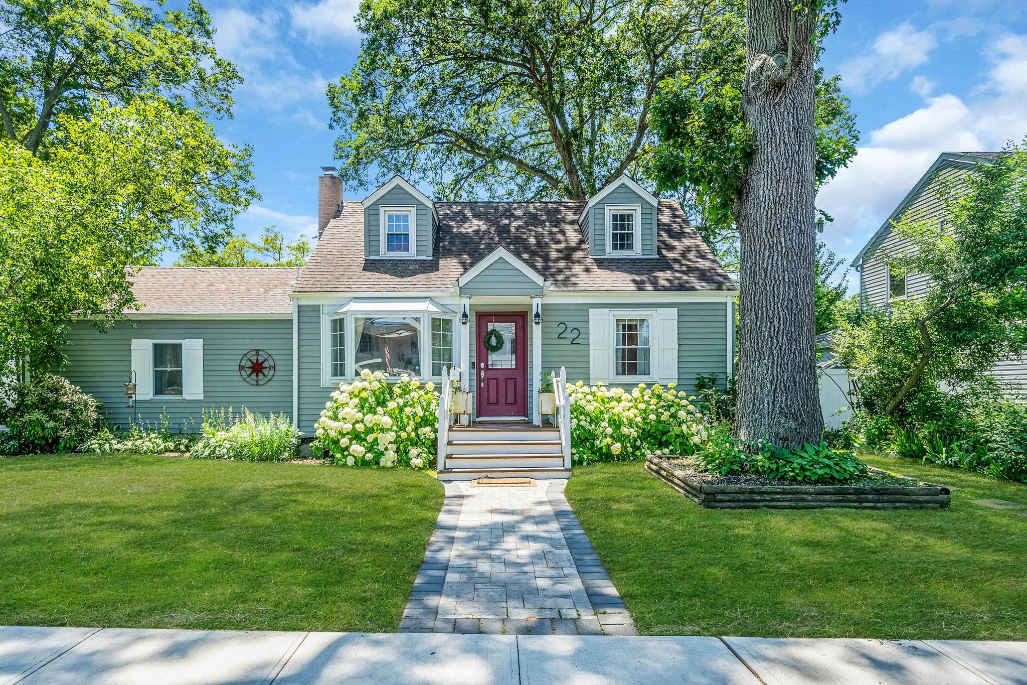 a front view of a house with garden