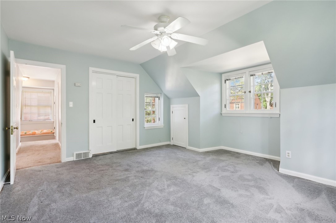 2620 Charney Road Cleveland, OH 44118 - Photo 20 of 43 Additional living space featuring lofted ceiling, carpet flooring, and ceiling fan