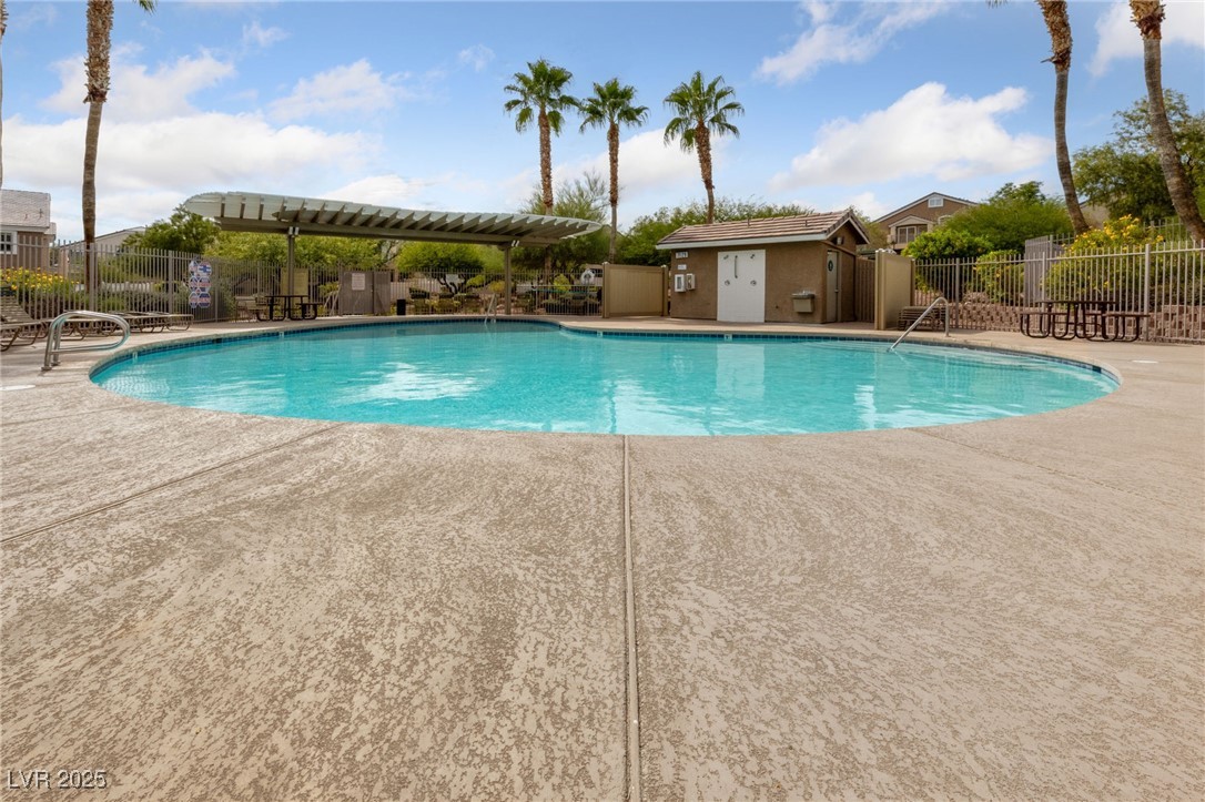 9068 Bushy Tail Avenue, Unit 103 Las Vegas, NV 89149 - Photo 16 of 32 Community pool with a covered patio