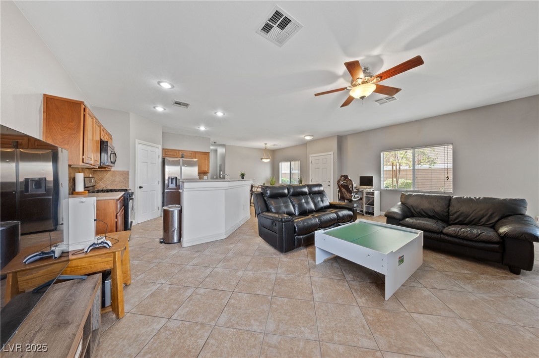 9068 Bushy Tail Avenue, Unit 103 Las Vegas, NV 89149 - Photo 32 of 32 Open Floor plan with tiled flooring and high ceilings.