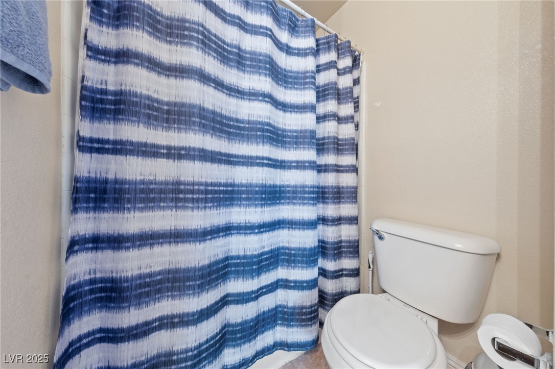 9068 Bushy Tail Avenue, Unit 103 Las Vegas, NV 89149 - Photo 31 of 32 Guest Bathroom with tub and shower combo