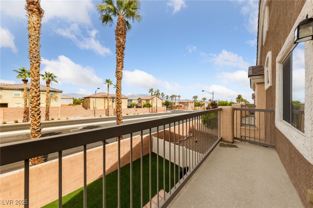 9068 Bushy Tail Avenue, Unit 103 Las Vegas, NV 89149 - Photo 8 of 32 Balcony with a residential view