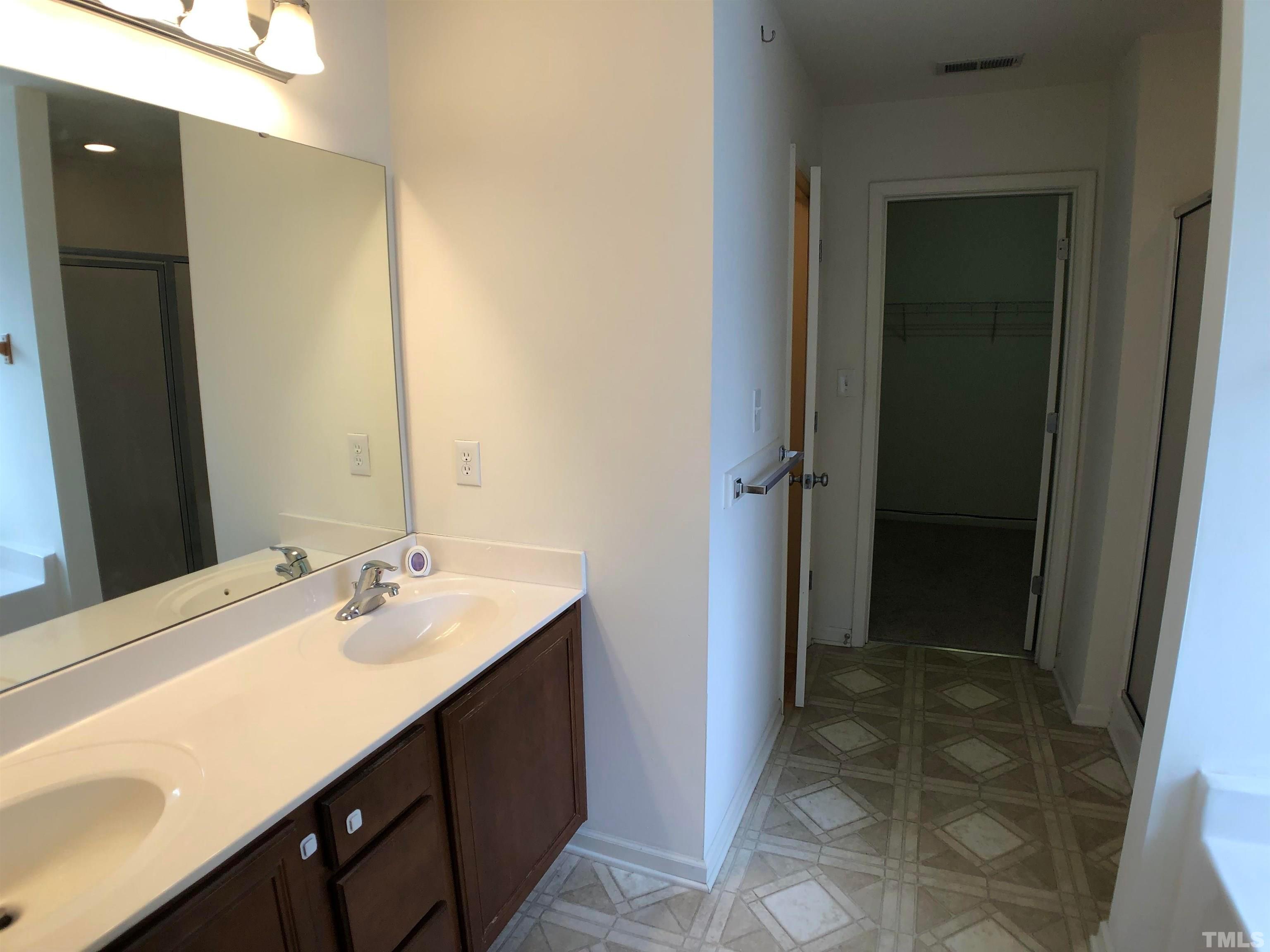 405 Hanson Road Durham, NC 27713 - Photo 16 of 27 a bathroom with a sink vanity and a mirror