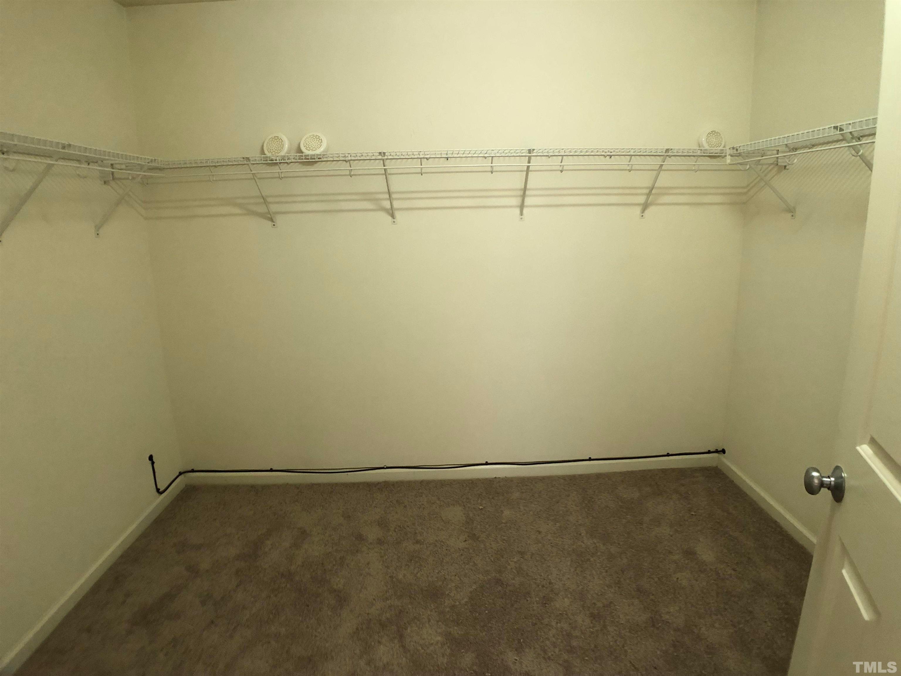 405 Hanson Road Durham, NC 27713 - Photo 18 of 27 a view of a room with racks on the wall