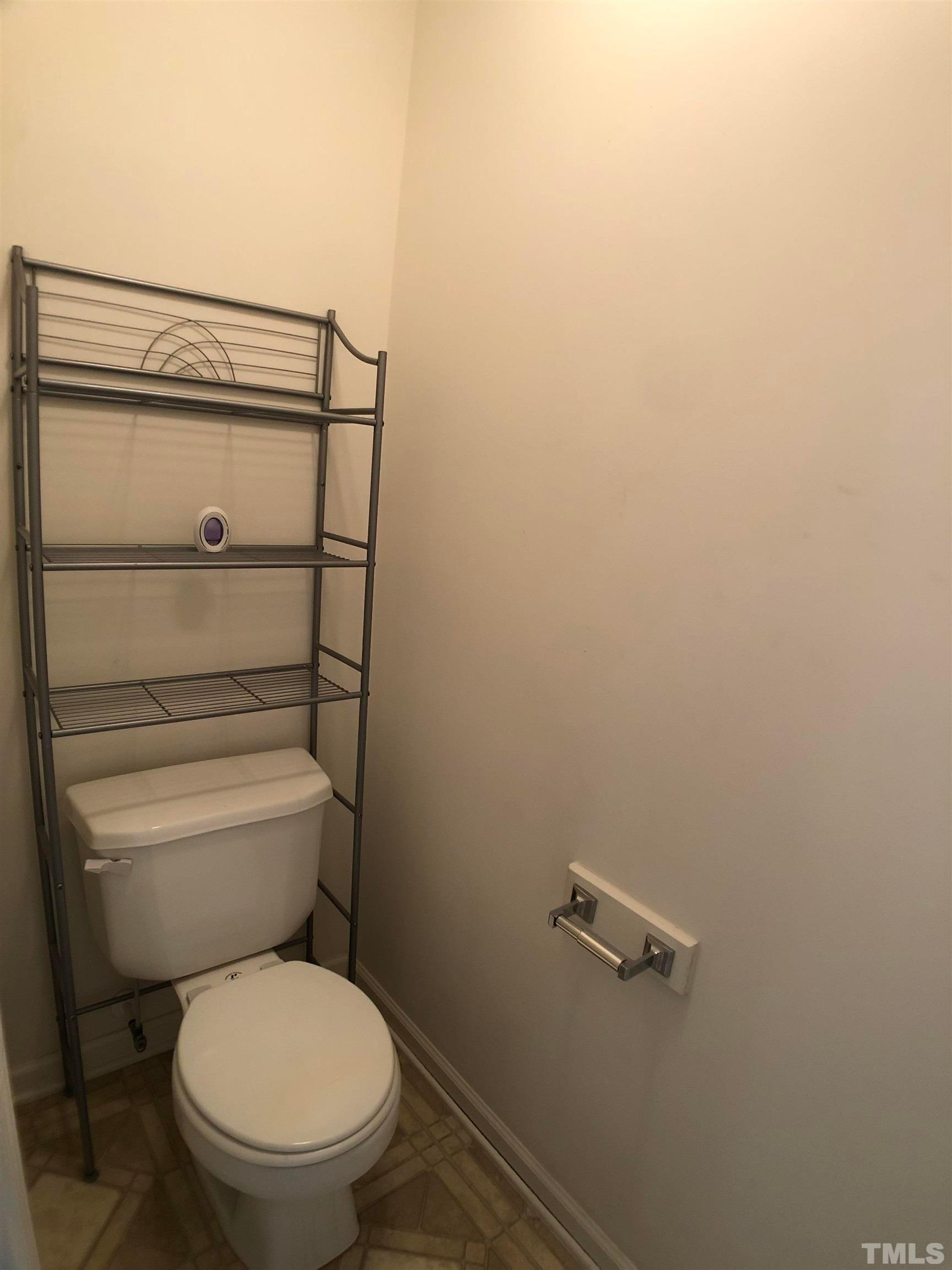 405 Hanson Road Durham, NC 27713 - Photo 19 of 27 a bathroom with a toilet and a shower