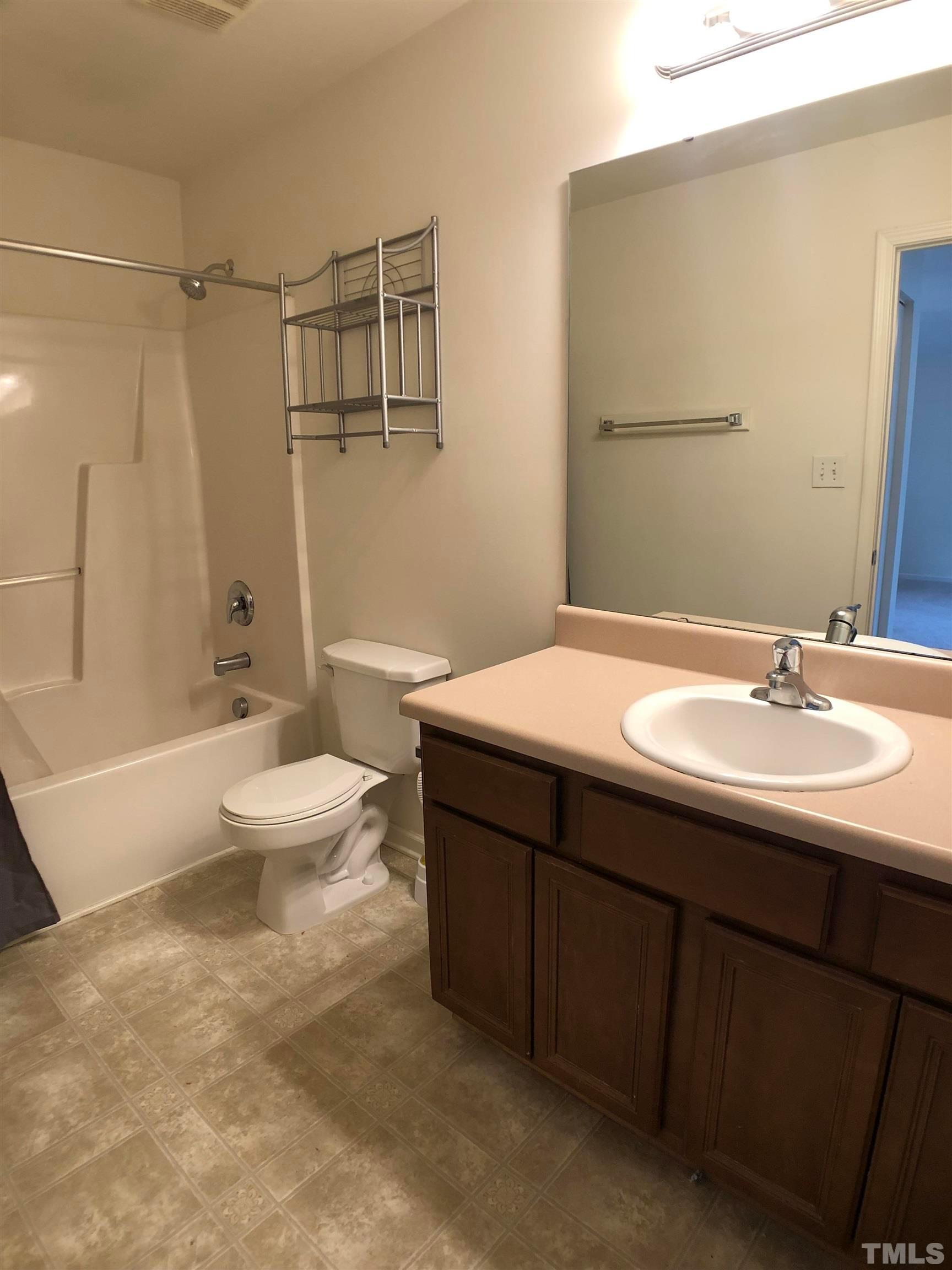 405 Hanson Road Durham, NC 27713 - Photo 23 of 27 a bathroom with a sink and a mirror