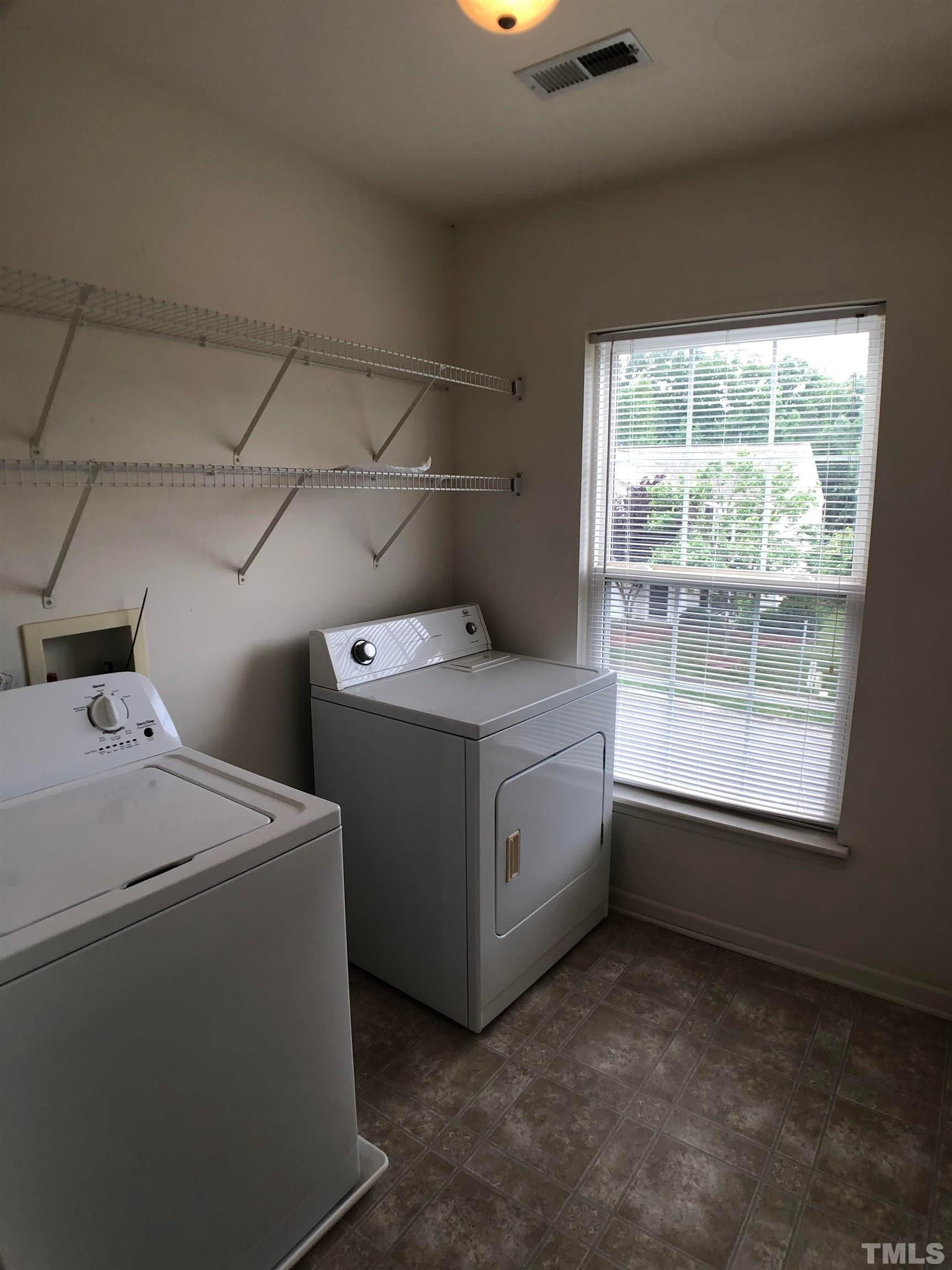 405 Hanson Road Durham, NC 27713 - Photo 24 of 27 a utility room with dryer and washer