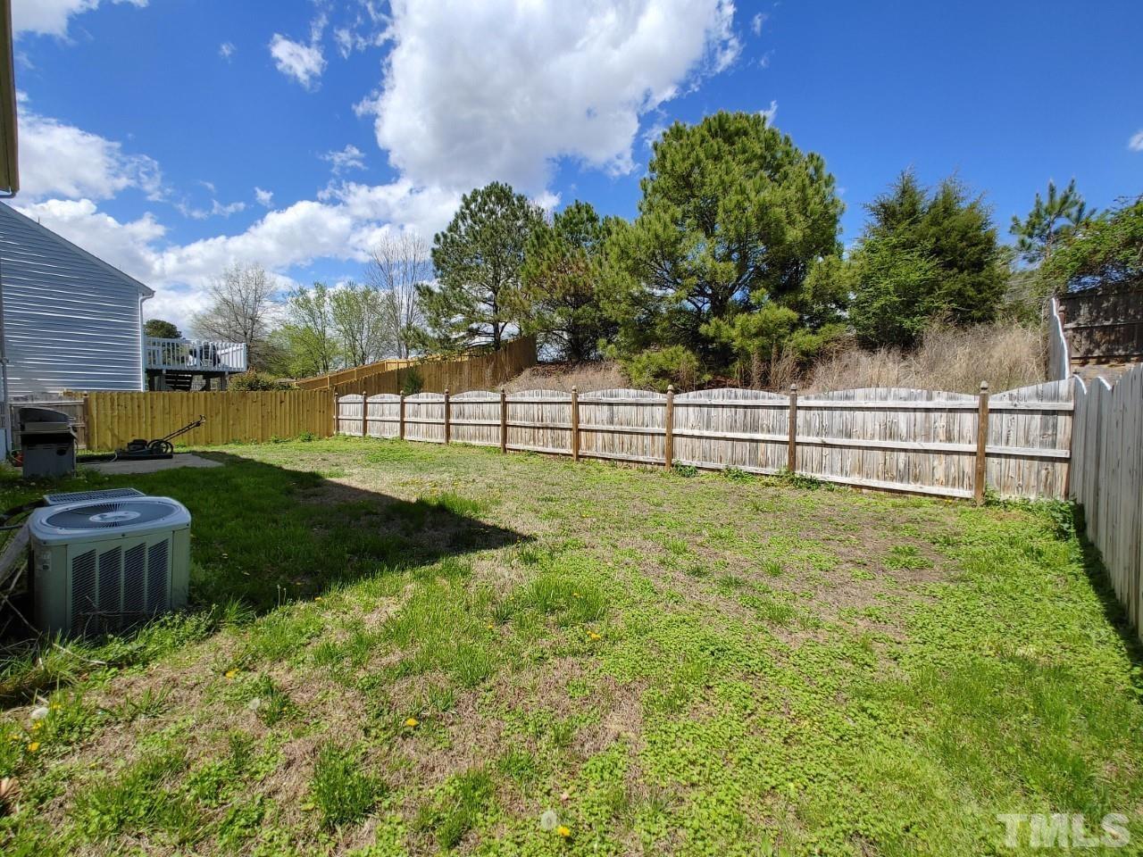 405 Hanson Road Durham, NC 27713 - Photo 26 of 27 a view of a garden with a large tree in front of it