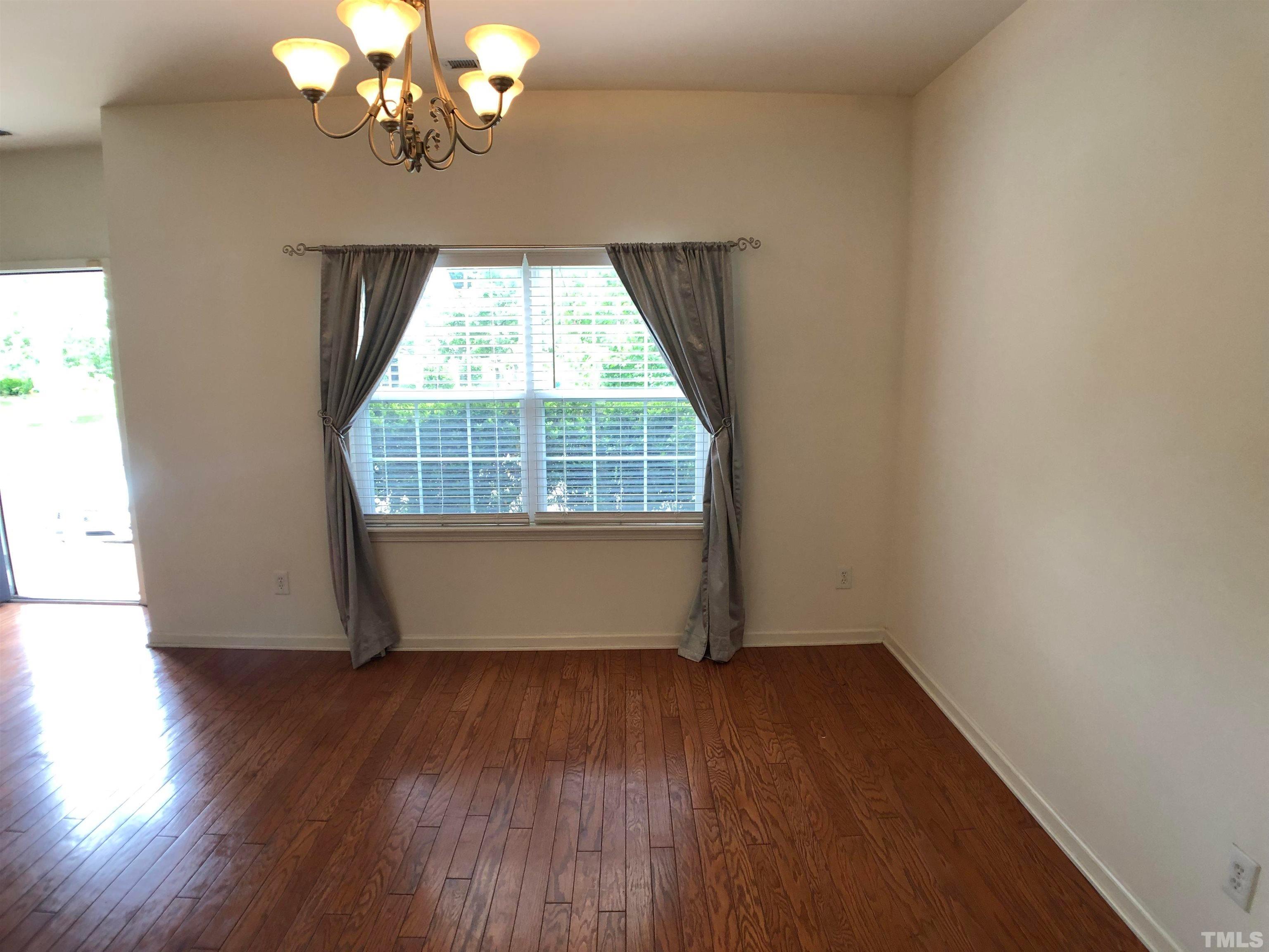 405 Hanson Road Durham, NC 27713 - Photo 5 of 27 wooden floor in an empty room with a window
