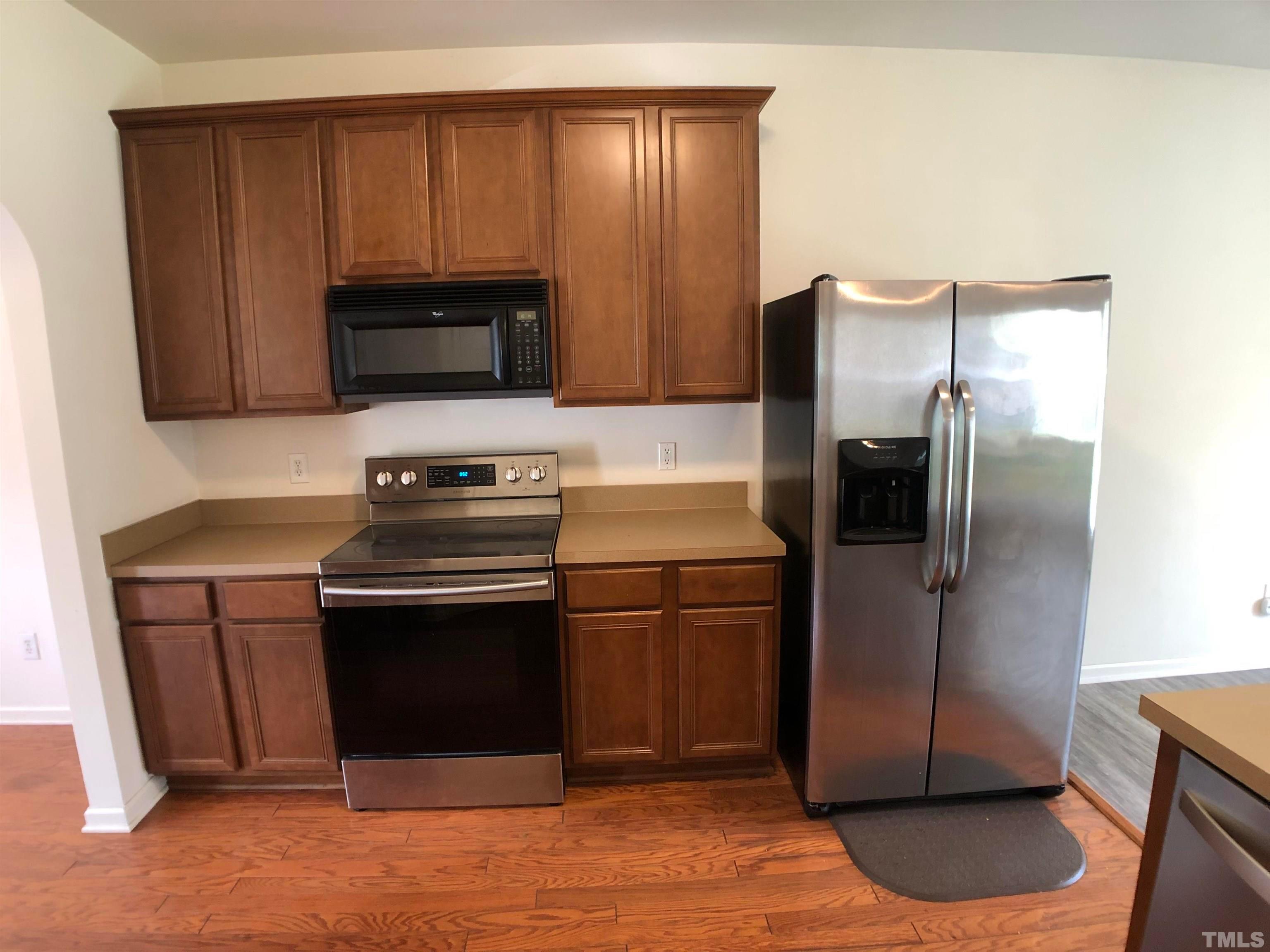 405 Hanson Road Durham, NC 27713 - Photo 8 of 27 a kitchen with a refrigerator stove and microwave
