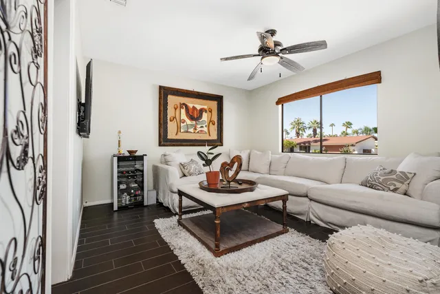 a living room with furniture and a table