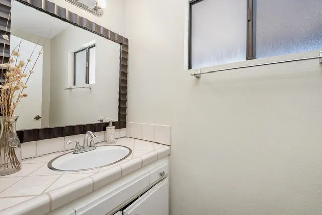 a bathroom with a sink and a mirror