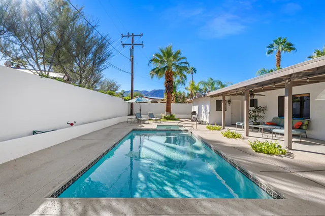 a view of a swimming pool with a patio