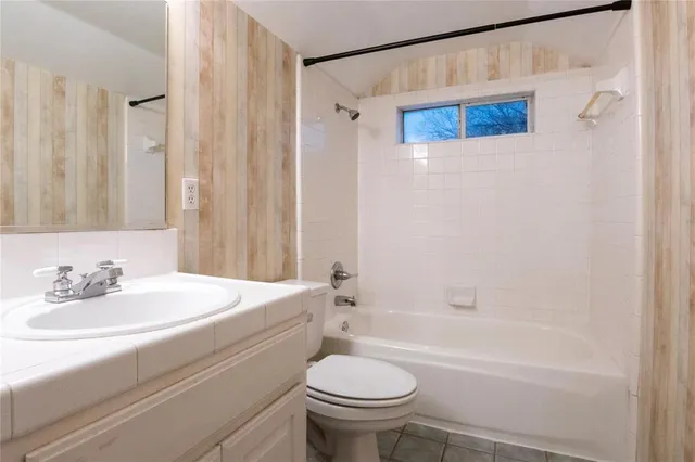 a bathroom with a sink a toilet and a bathtub